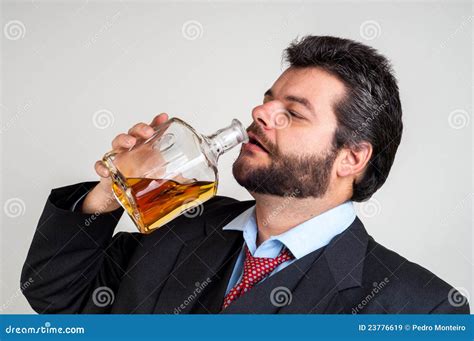 Businessmen Drinking From A Bottle Of Whiskey Royalty Free Stock Images - Image: 23776619