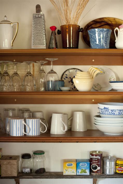 Open storage shelves in a farmhouse kitchen - Free Stock Image