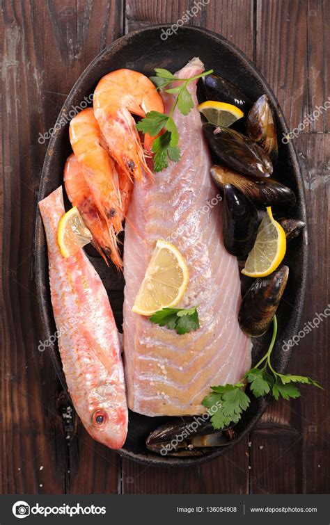 Assorted raw fish Stock Photo by ©studioM 136054908