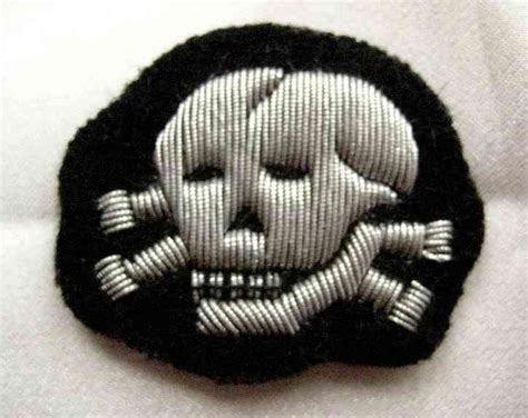 SS Totenkopf officers cap badge. Deaths head cap insignia