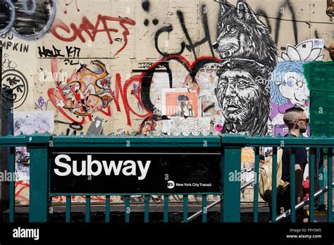 New York City subway station with graffiti in the background and subway ...