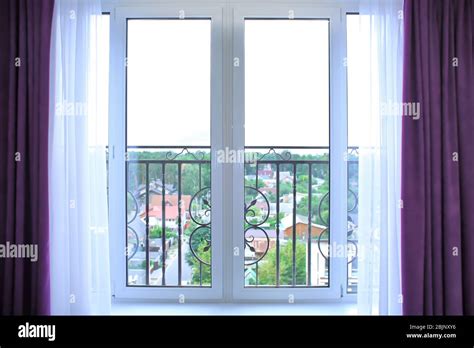 Window with beautiful white curtains in modern apartment Stock Photo ...