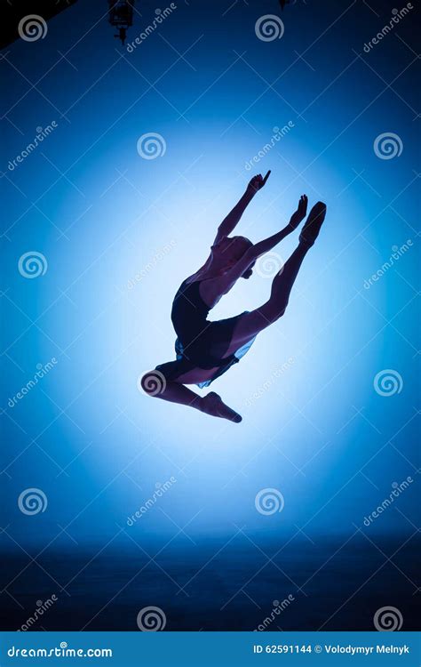 The Silhouette of Young Ballet Dancer Jumping on a Stock Photo - Image of leap, action: 62591144