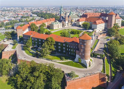 Kraków Wawel : Poland Krakow Wawel Castle Blooming Park And Domes Of The Cathedral Against A ...