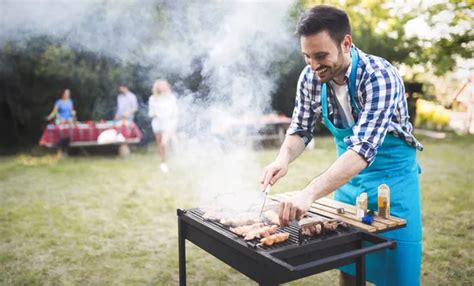 Happy male preparing bbq meat — Stock Photo © nd3000 #172187440