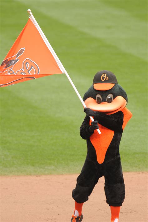 Baltimore Orioles mascot celebrates a win after a baseball game against the Colorado Rockies on ...