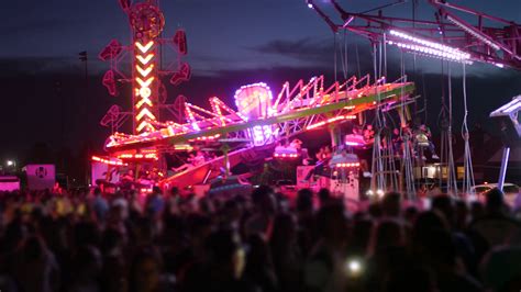 People Having Fun On Bright Carnival Rides Stock Footage SBV-324193278 - Storyblocks