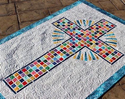 a quilted table top with a cross on it