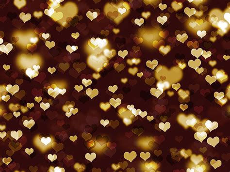 an image of many hearts that are in the dark night sky with gold lights on them