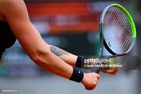 The tattoo of Belarus' Aryna Sabalenka is pictured as she prepares to ...