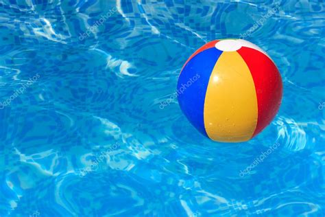 A colorful beach ball floating in a swimming pool — Stock Photo © david010167 #6670937