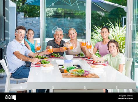 Family in big house Stock Photo - Alamy