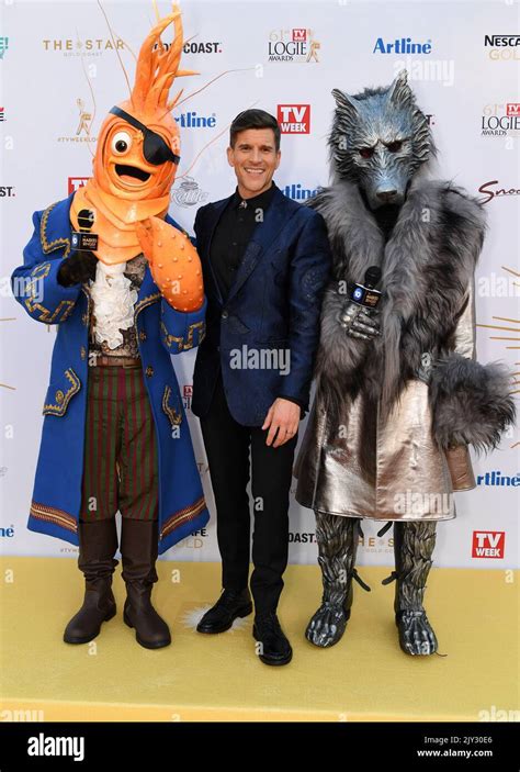 Osher Gunsberg (centre) and characters from the 'The Masked Singer ...