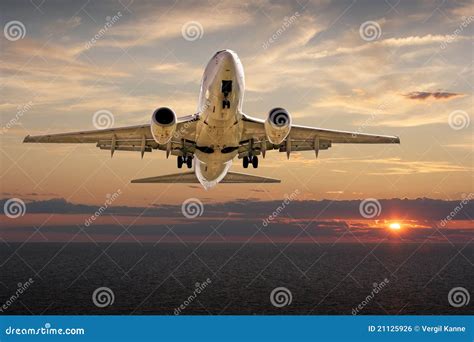 Airplane Landing at Sunset stock photo. Image of sunset - 21125926