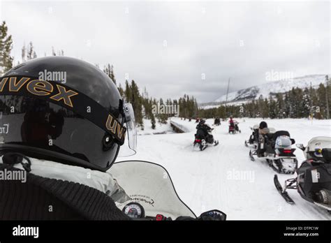 Snowmobile Tour through the Yellowstone National Stock Photo - Alamy