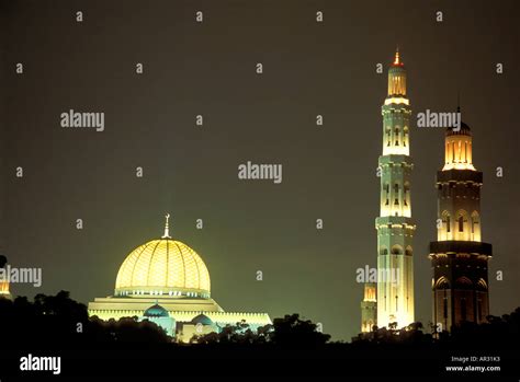 Illuminated grand mosque at night, Muscat, Oman, Middle East, Asia ...