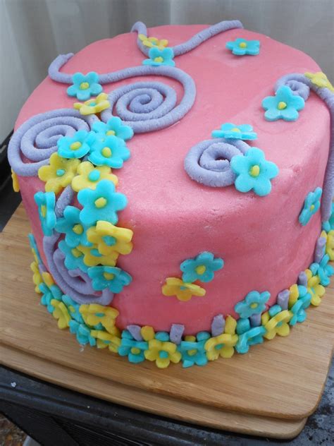 Pink Swirls And Flowers Cake - CakeCentral.com