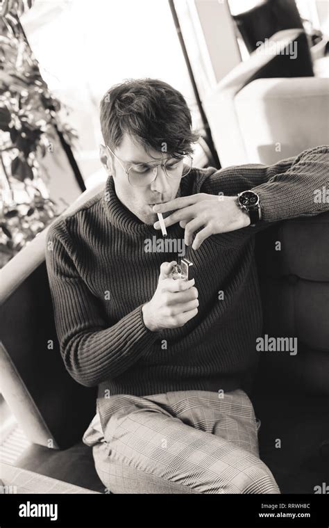 black and white photo of man smoking cigarette in cafe Stock Photo - Alamy