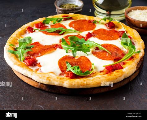 Hot homemade Italian pizza margherita with mozzarella and tomatoes on ...