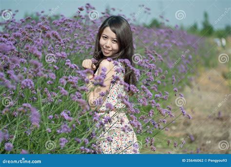 Young Girl Smiling in the Flowers Stock Photo - Image of skirt, lavender: 25646062