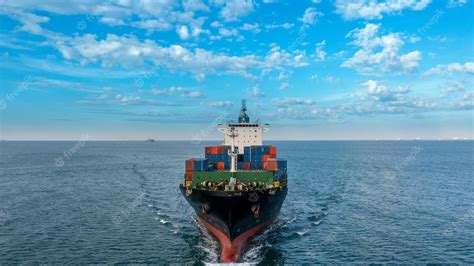 Premium Photo | Aerial side view of cargo ship carrying container and ...