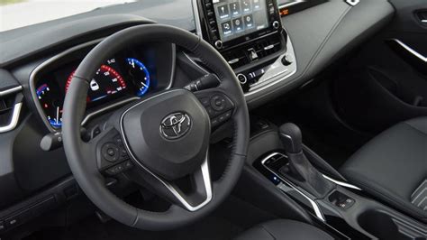 the interior of a car with steering wheel, dashboard and infotains on ...