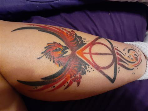 My Harry Potter tattoo! Combination of the Deathly Hallows and the Phoenix that I've always ...