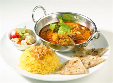 Indian curry served with rice and naan | Stock Photo | Colourbox