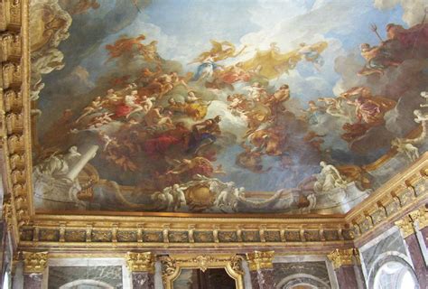 an ornate painting on the ceiling of a building