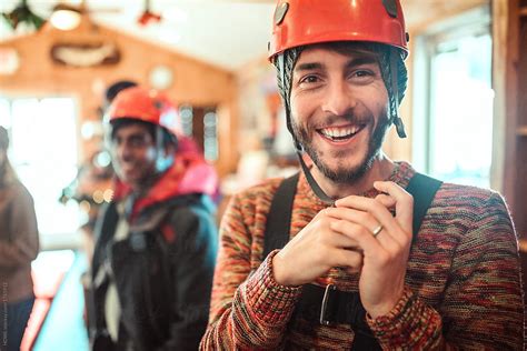 "A Young Man Smiles Before Joining His Friends On A Zip Lining Adventure" by Stocksy Contributor ...