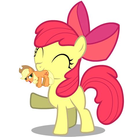 the pinkie pony is holding an apple in her hand and looking at it's face