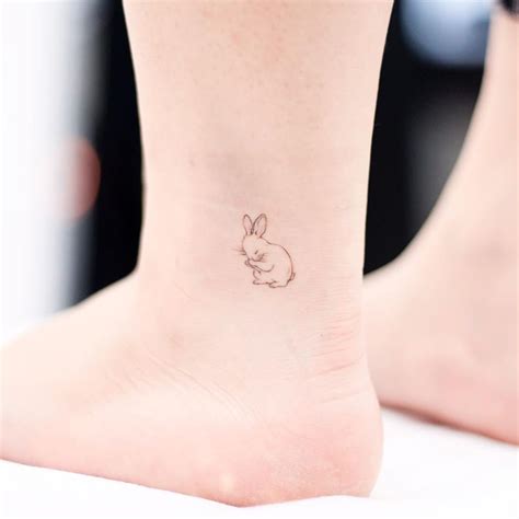 Tattoo uploaded by Tattoodo • Bunny tattoo by Donghwa tattoo #Donghwa #bunnytattoo #linework # ...