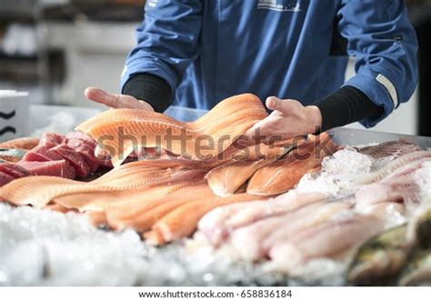 Fishmonger Selling Fish Stock Photo (Edit Now) 658836184