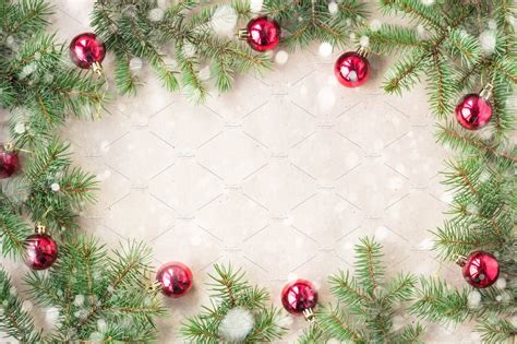 Festive christmas border with red balls on fir branches and snowflakes ...