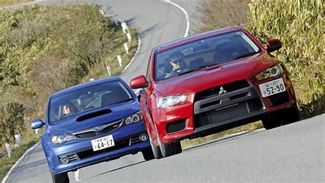 Mitsubishi Lancer Evo X vs Subaru Impreza WRX STI | Auto Express