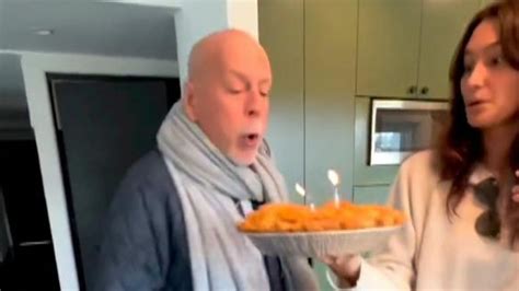 Bruce Willis sings and blows out candles as he celebrates 68th birthday following dementia ...