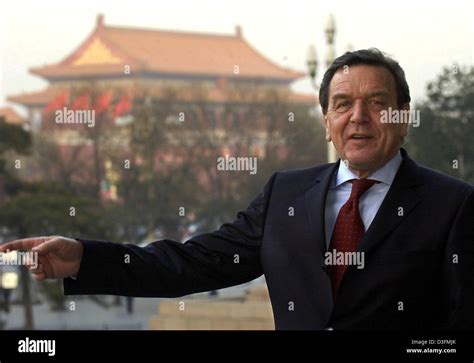 (dpa) - German Chancellor Gerhard Schroeder holds a TV interview in front of the Forbidden City ...