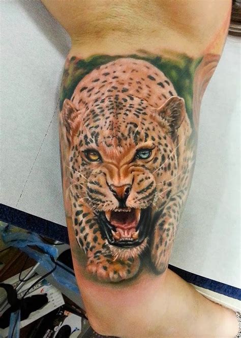 Cool colorful running cheetah tattoo for men on upper arm - Tattooimages.biz