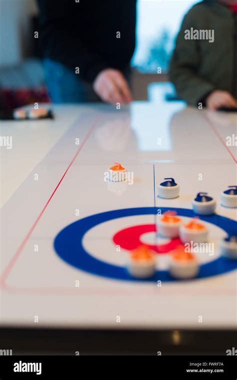 Table curling game Stock Photo - Alamy