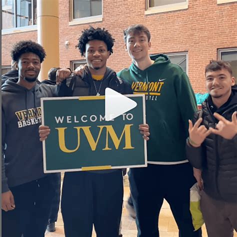 Students hold a sign that says Welcome to UVM