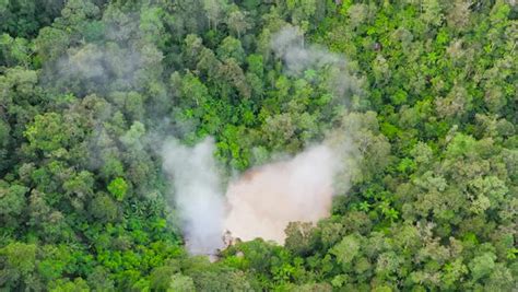 Aerial drone of lake near the Apo volcano in a rainforest in the mountains. Lake Agco, Mindanao ...