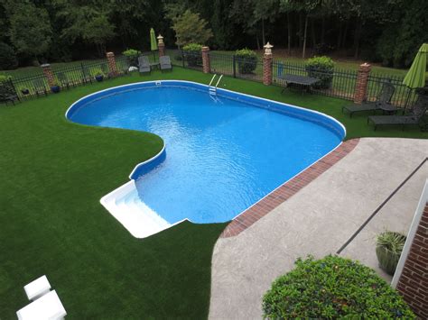 Swimming pool surround with artificial turf. | Diy artificial turf, Swimming pools, Artificial ...