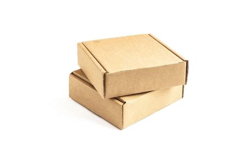 Premium Photo | Two cardboard boxes on a white surface