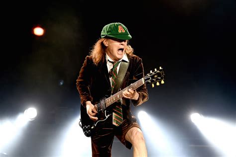 The True Story Of How AC/DC's Angus Young Decided To Wear School Uniforms