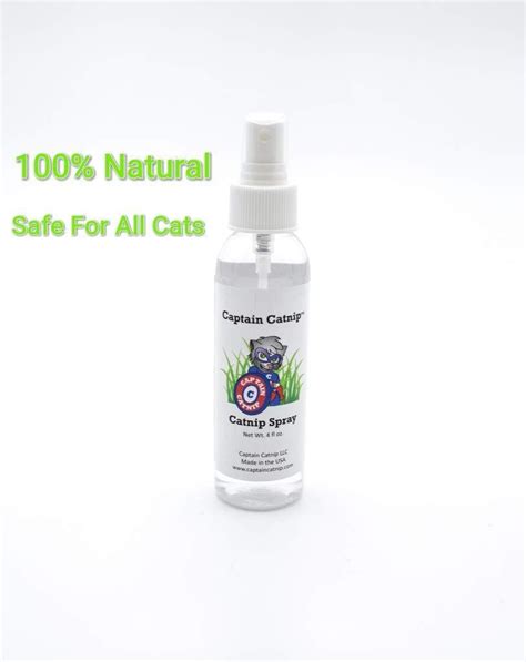 a bottle of catnip spray sitting on top of a white background with the words, 100 % natural safe ...