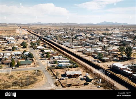 Aerial photograph of the US-Mexico border fence in Arizona. See ...