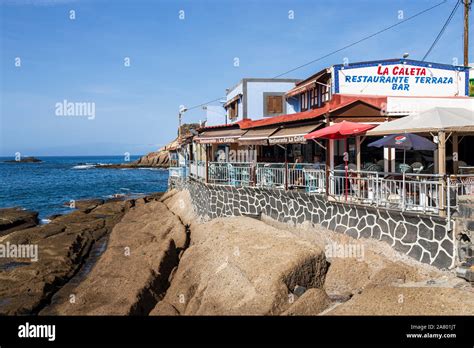 Restaurant, Terrace Bar, Cafe on the seafront in the early morning at La Caleta, Costa Adeje ...