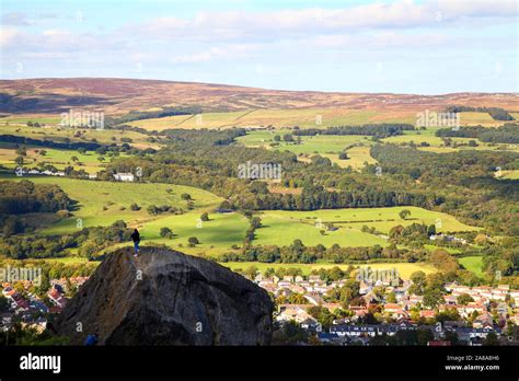 People climbing the cow and calf rocks on Ilkley moor Stock Photo - Alamy