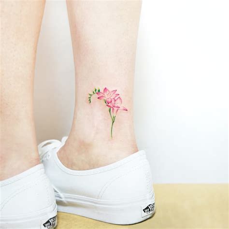 22 Beautiful and Delicate Freesia Tattoo Designs | TattooAdore