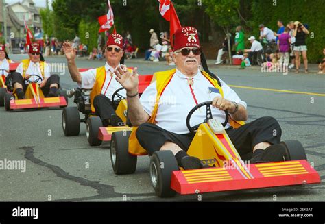 A local Shriner´s service group riding go carts in a parade for the ...